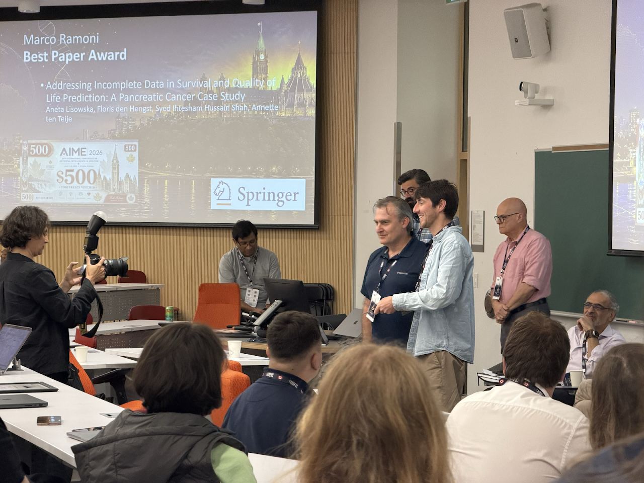 Conference organizers hand over the award